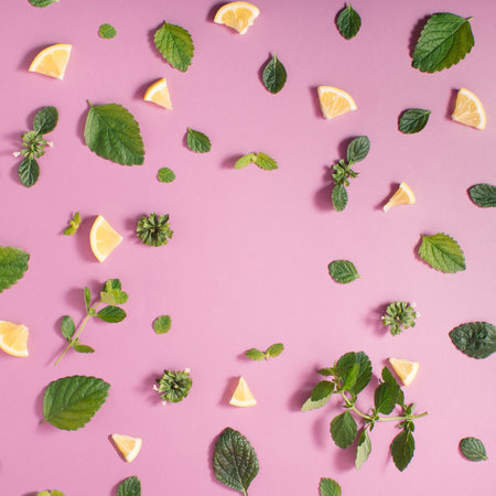 Colorful pattern made of pieces of lemon fruits and lemongrass leaves. Flat layの写真素材