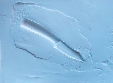 Powder texture with creative knife impression. Neon blue color lights. Minimal Halloween concept. Flat layの写真素材