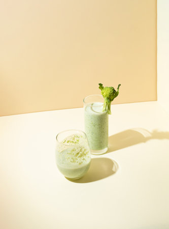 Broccoli smoothie in a glass. Minimal healthy concept with creative copy space.の写真素材