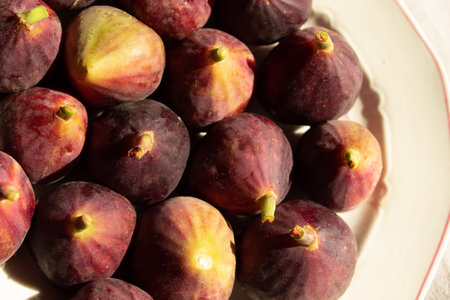 Ripe figs on the plate. Flat lay. Close up.の写真素材