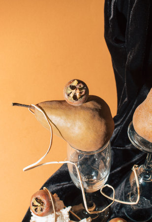 Artistic still life with pears, shell and medlar. Creative poster and wallpaper concept with details.の写真素材