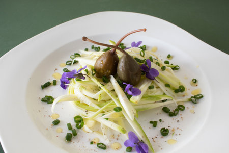 Vegan meal of zucchini, capers, spices and violets. Healthy food concept. Flat lay.の写真素材