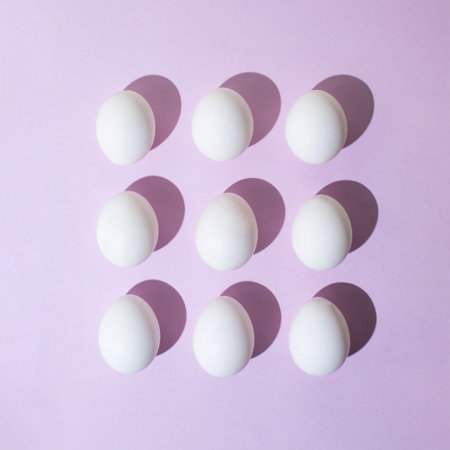 Creative layout made of eggs on pastel purple background. Flat lay. Easter concept.