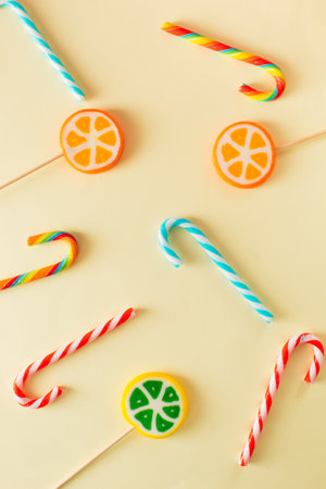 Colorful lollipops on beige background. Minimal concept ideaの写真素材