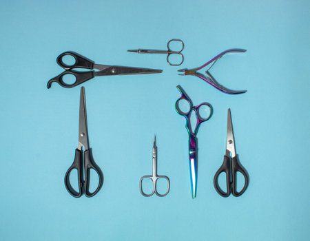 Scissors creatively arranged on a blue background. Pattern