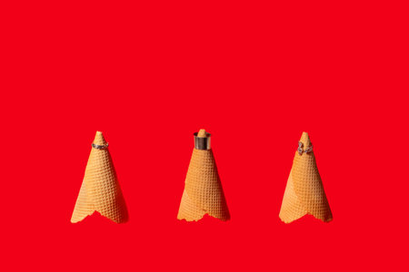 Three ice cream cones with rings on top. Creative concept idea