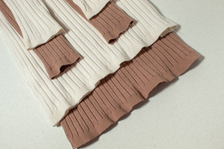 Two folded knitted warm sweaters. Winter clothing concept