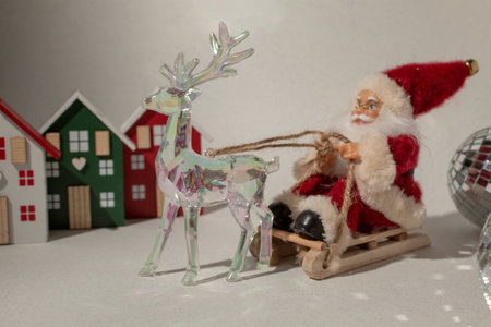 Santa Claus on a sleigh and glass reindeer. Minimal compositionの写真素材