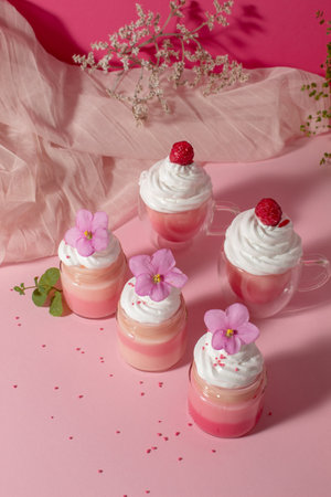 Pink cream with whipped cream and violets. Sweet love foodの写真素材