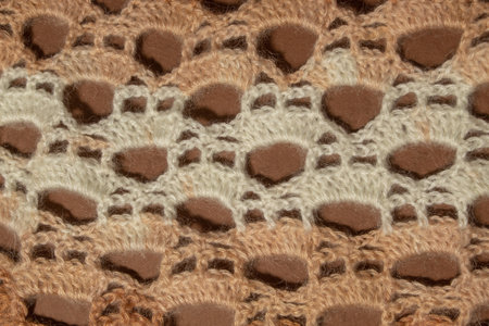 Wool hand-knit mocha, beige and brown shade sweater. Clothes textile background