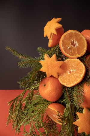 Christmas tree made of orange fruit and evergreen branchesの写真素材