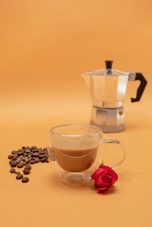 Coffee pot, espresso with coffee beans on brown background.の写真素材