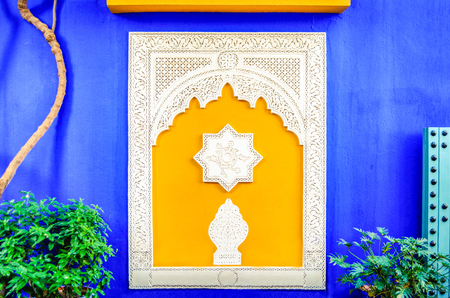 Colorful window in Jardin Majorelle, former residence of fashion designer Yves Saint Laurent in Marrakesh Morocco. Yellow window frames of the blue house of Yves Saint-Laurent. Museum of Islamic art.の写真素材