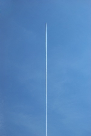 Jet contrail against a pristine blue sky