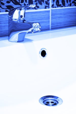 A modern basin mixer tap in a contemporary bathroomの写真素材