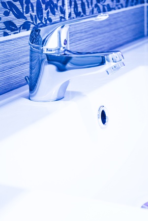 A modern basin mixer tap in a contemporary bathroomの写真素材