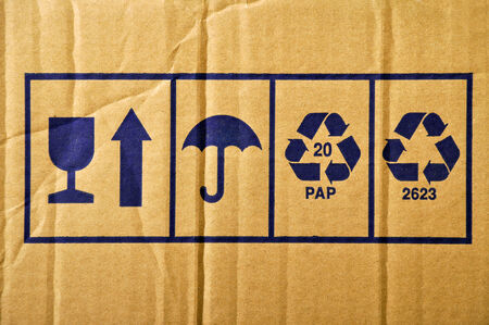Torn cardboard and paper recycling signの写真素材
