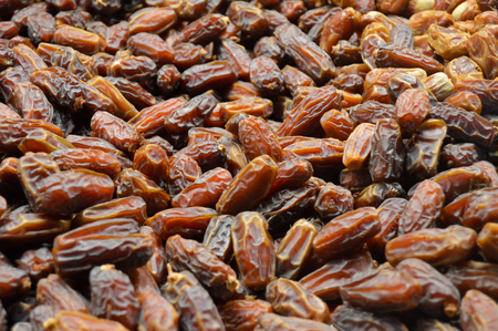 Dates the edible fruit of the date palm