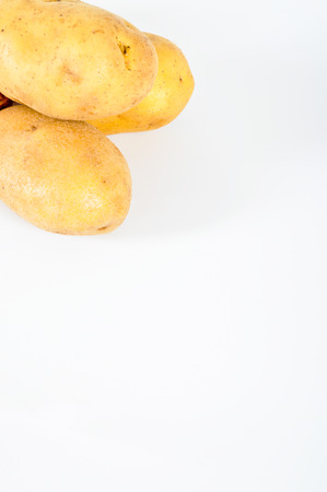 Fresh yellow potato isolated on white backgroundの写真素材