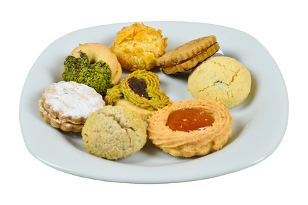 Various and delicious cookies in white plateの写真素材