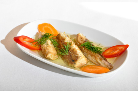 Mackerel cooked in olive oil in white plateの写真素材