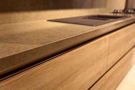 Interior of luxurious modern kitchen equipment and oak grey cabinetsの写真素材