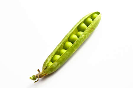 Fresh green peas and grains, nutritious green vegetables, isolated on white backgroundの写真素材