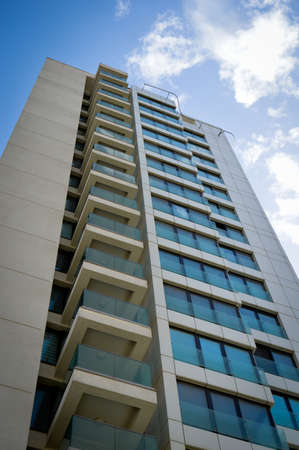 Business center, institutional glass tower, modern glass building, business center with blue sky