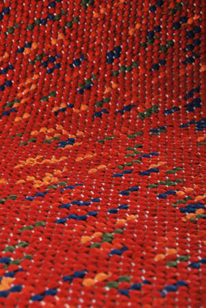 Seamless red carpet rug texture background from above, carpet material pattern texture flooring