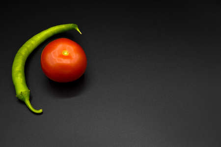 Fresh, tasty, tomato and green pepper, all organic tomato, fresh organic tomato, isolated on black...