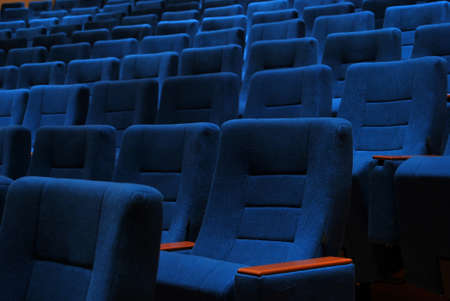 Modern cinema hall empty and blue comfortable seats, movie theater seats or chairの写真素材