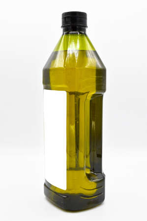 Natural olive oil packed in plastic bottle, product ready to use, isolated on white backgroundの写真素材