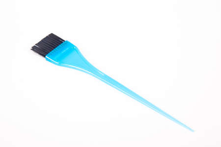 Blue plastic bristle brush used for hair coloring in hairdressersの写真素材