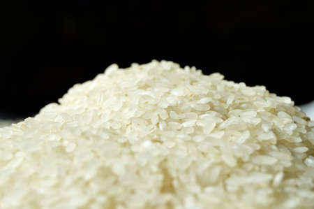 Fresh organic white raw dried rice grains texture, uncooked rice background
