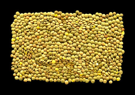 Dry green lentil grains isolated on black background
