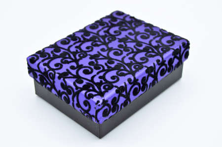 Ornate purple a gift box, ideal for special occasions and Christmas, isolated on white background