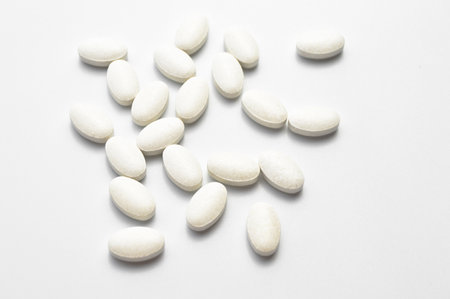 White oval tablet pills isolated on white background, medical oval pills tabletsの写真素材