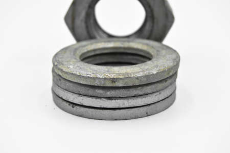 Galvanized steel metal with washer and nut, isolated on white background
