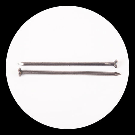 A lot of construction iron two nails, industrial parts, isolated on white backgroundの写真素材