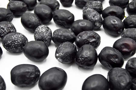 Fresh delicious black color turkish olives isolated on white background