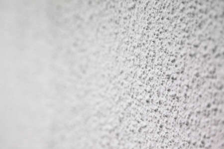White and gray colored wall texture with rough surface, two color rough wall plasterの写真素材