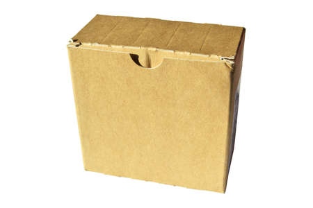 Closed beige rectangular cardboard box with corrugated cardboard lid isolated on white background