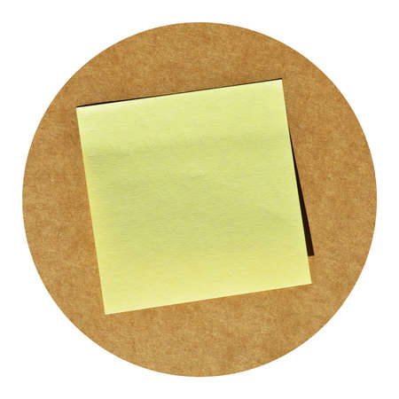 Square sticky yellow note paper on beige and brown cardboard paperの写真素材