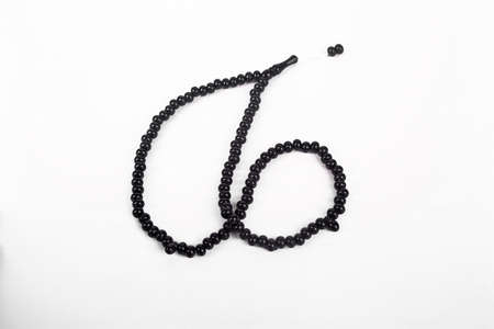 Oltu rosary, black stone, beads sequenced short rosary, an important accessory for Turkish culture, isolated on white backgroundの写真素材