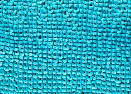 Pattern fabric made of wool. Handmade knitted fabric turquoise wool background textureの写真素材