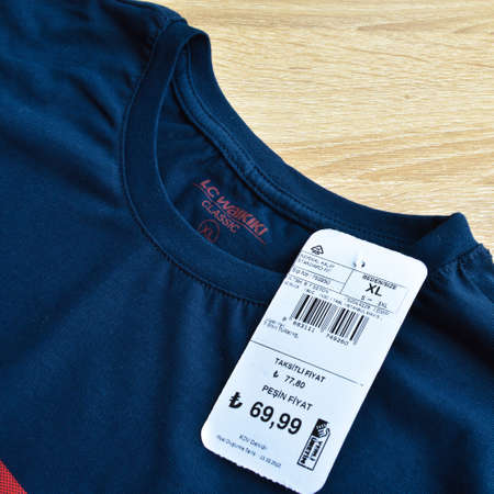 New navy blue LC Waikiki xl t-shirt and blank label, on wooden floor, may 01 2022 Istanbul Maltepe...