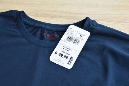 New navy blue LC Waikiki xl t-shirt and blank label, on wooden floor, may 01 2022 Istanbul Maltepe...