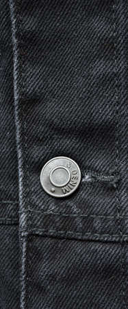 Black jeans denim coat jacket, metal buttom detail, jeans fabric textureの写真素材