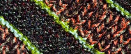 Pattern fabric made of wool. Handmade knitted fabric colored wool background texture