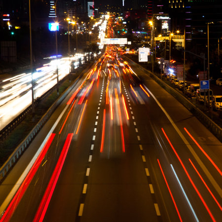 Istanbul Turkey D 100 highway Maltepe Esenkent stop congested evening traffic, lights of the city...